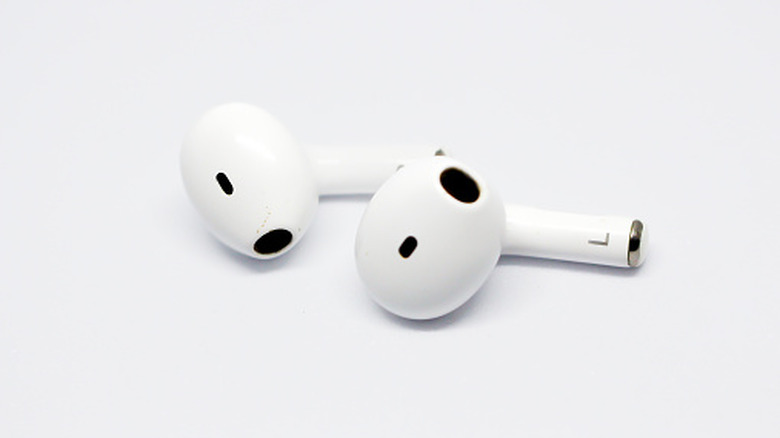 A pair of Apple AirPods on a white background