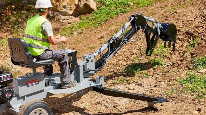 Central Machinery 8-HP Towable Backhoe in use