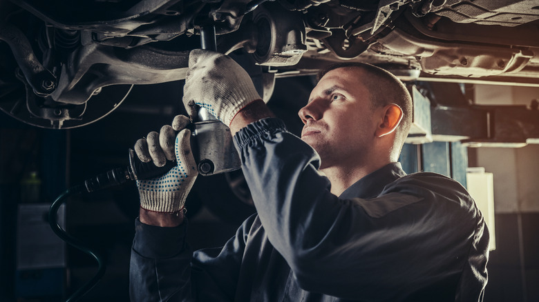 mechanic working on car