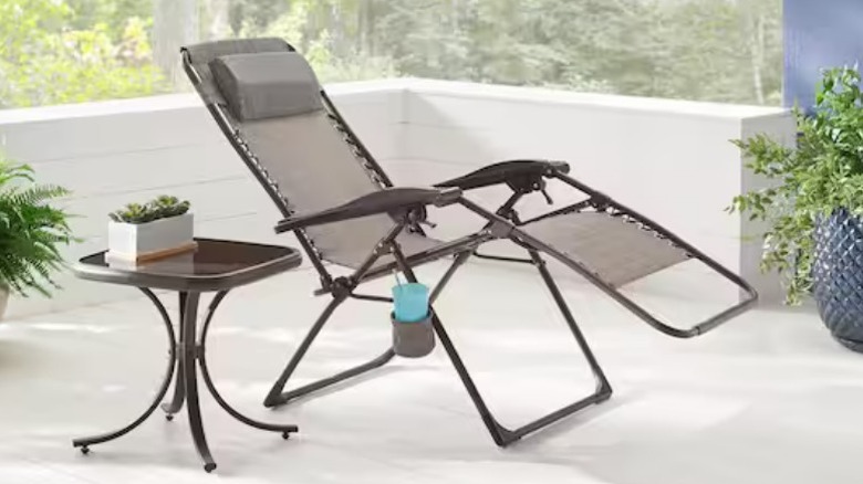 StyleWell Folding Zero Gravity Steel Outdoor Patio Sling Chaise Lounge Chair on patio