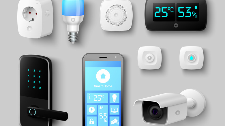 Many smart gadgets surround a phone on a desk.