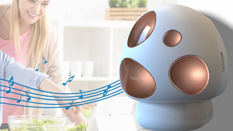 A giant shroom-shaped alarm plugged into a wall outlet.