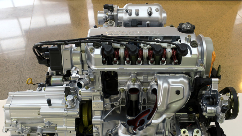 A Honda D16Y8 engine and transmission on display at the Honda Heritage Museum