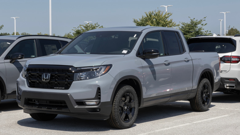 A Honda Ridgeline parked at a dealership.