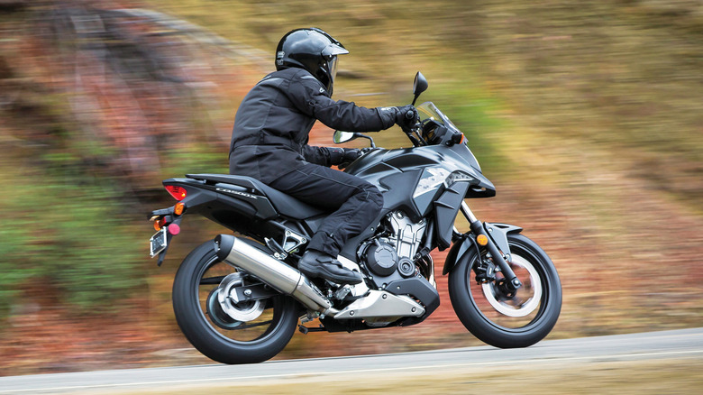 Side profile of the Honda CB500X on the road