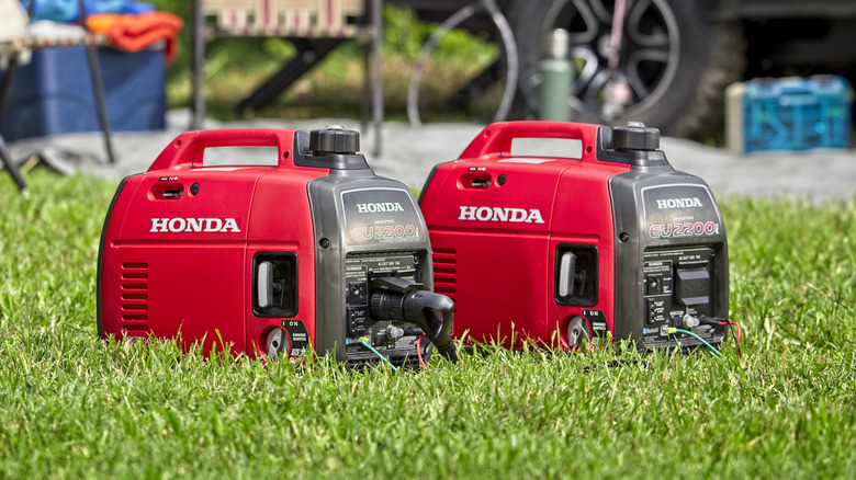 Pair of Honda EU2200i generators at a camp site.