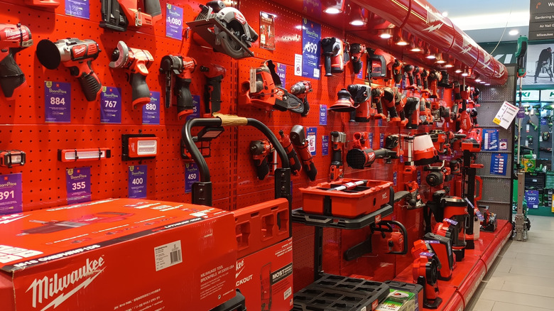a store shelf filled with Milwaukee tools