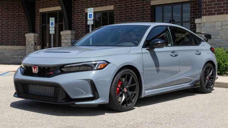 A gray Honda Civic Type R parked outside.
