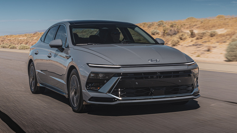 gray 2027 Hyundai Sonata driving on a desert road