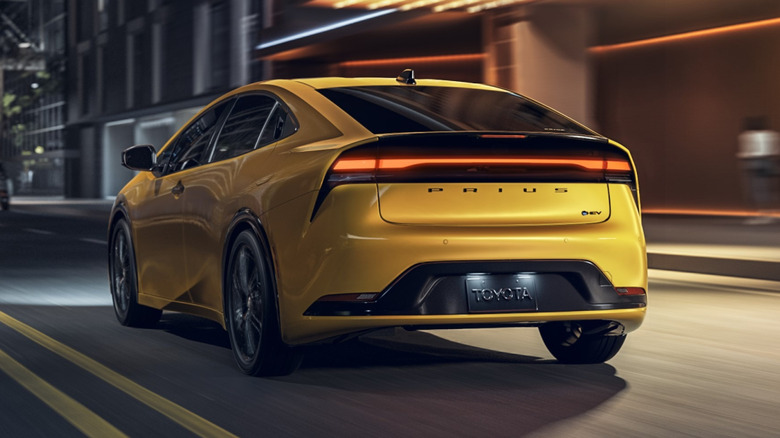 Rear 3/4 view of yellow 2025 Toyota Prius