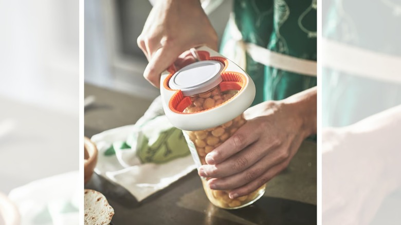the UPPFYLLD jar opener being used on a jar of nuts