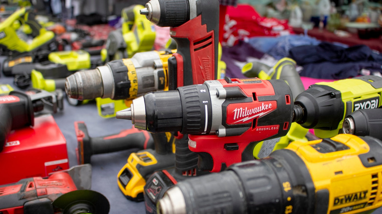 DeWalt and Milwaukee gear mixed together on a table.