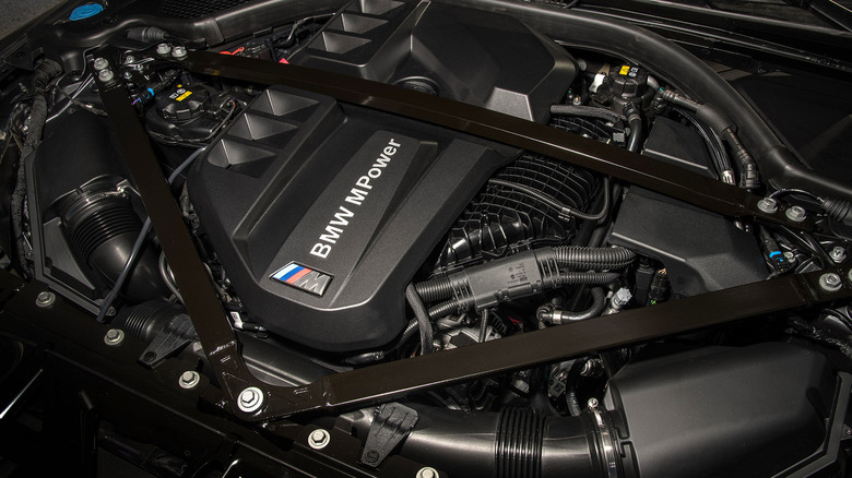 Top view of BMW S58 inline-6 engine in 2022 BMW M3 Competition engine bay.
