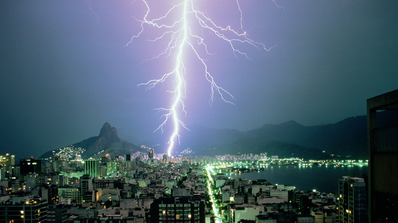 Lightning striking a city at night