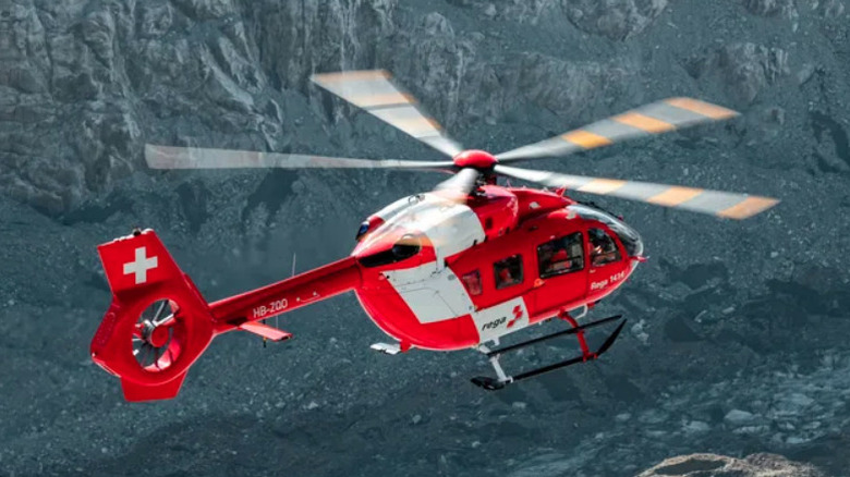 Airbus H145 D3 in flight over mountains