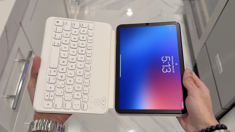 An ipad mini in a white keyboard case