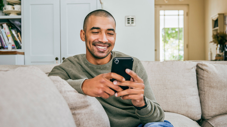 Man looking at iPhone