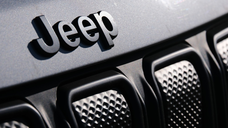 A close-up view of the Jeep logo near the grille