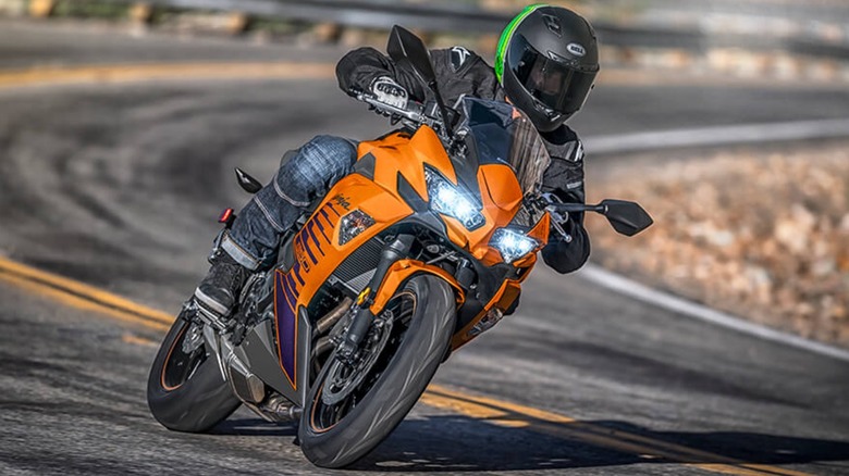 2025 Kawasaki Ninja 650 riding down a sharp turn