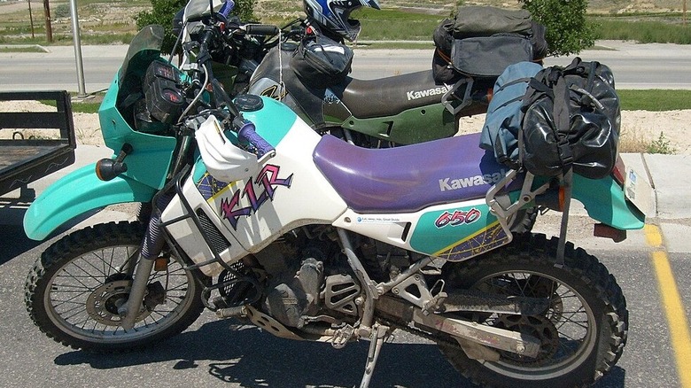 two Kawasaki KLR650 motorcycles parked side by side