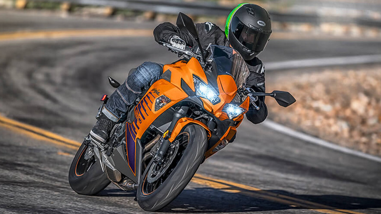 front profile view of the 2025 Kawasaki Ninja 650 riding down a road