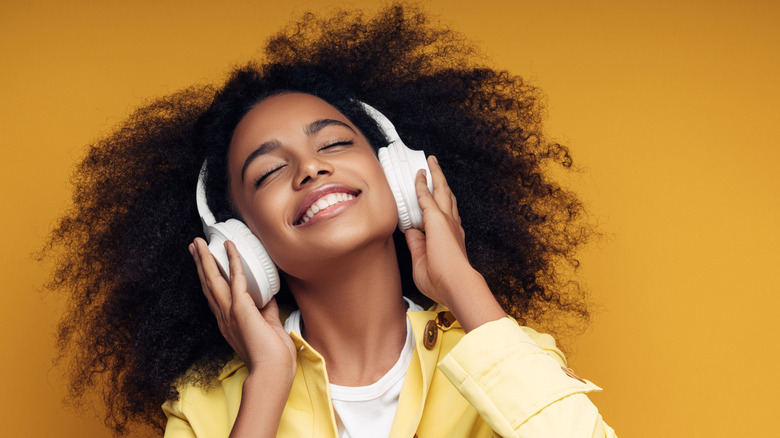 woman listening to music with headphones