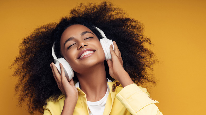 woman listening to music with headphones