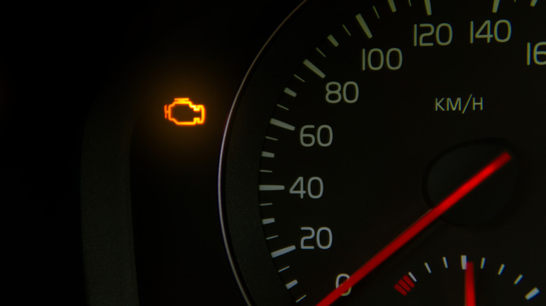 Yellow check engine light illuminated on a ca's dashboard
