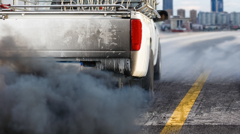 Black smoke from a pickup truck exhaust pipe