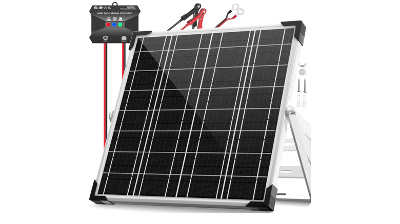 A solar battery charger next to a solar panel kit.