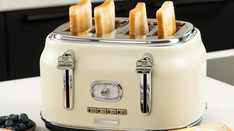 A retro-style four-slice toaster on a counter