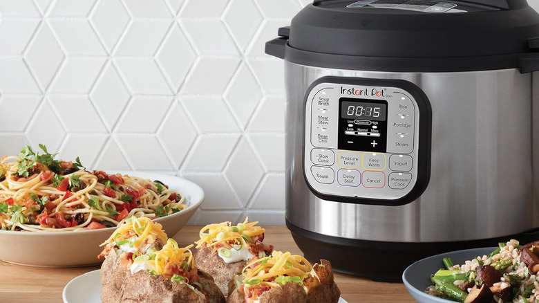 An Instant Pot cooker with food nearby