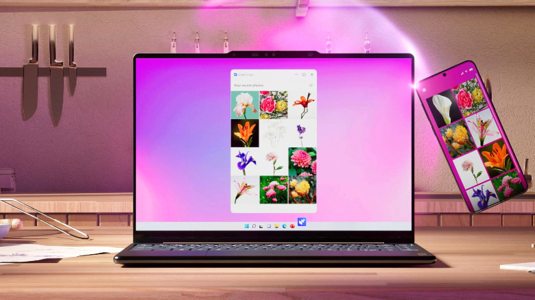 A Yoga 9i 2-in-1 Aura Edition on a kitchen counter, mirroring a phone screen.