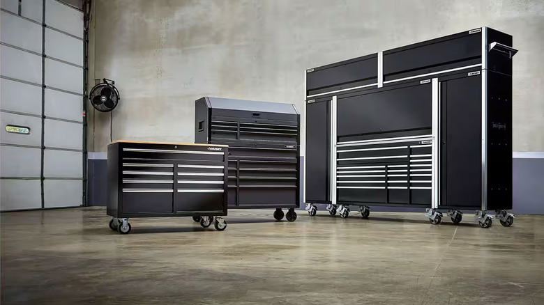 A selection of Husky branded tool storage chests in a garage.