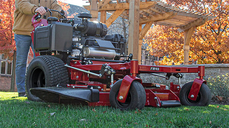 A person using a walk behind F45 Ferris mower.