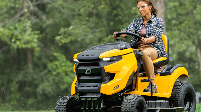 A person on an XT1 Cub Cadet riding lawn mower.
