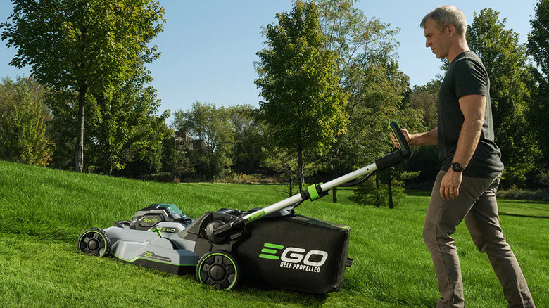 Side profile of the Ego 800 Series mower with a person pushing it