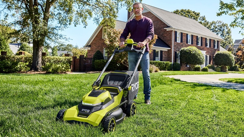 A person using a Ryobi 40 HP mower