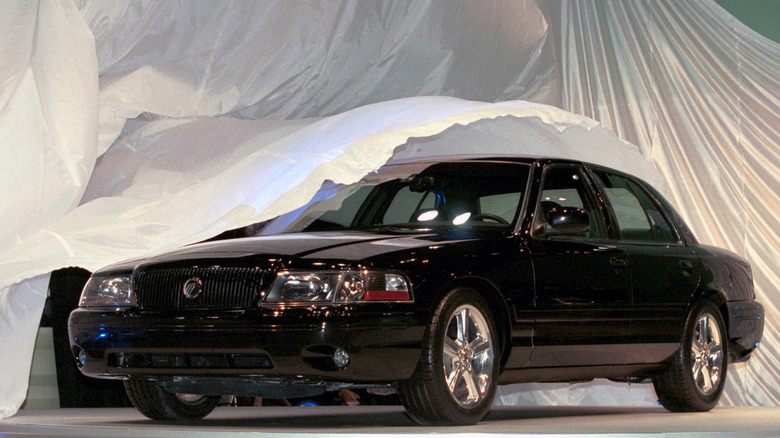 Front 3/4 view of black Mercury Marauder on stage.