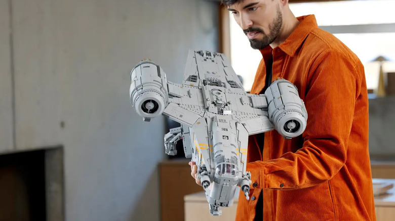 A man holding a built Razor Crest.