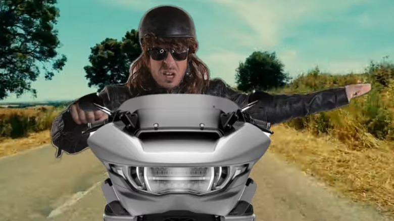 Slow down motorcycle hand signal