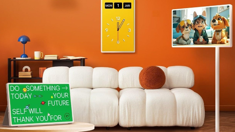 Various StanbyME 2 screens in a brown room with a white sofa.