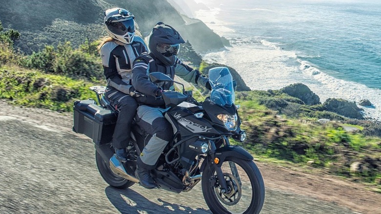 Two riders on Kawasaki Versys-X 300 on ocean road