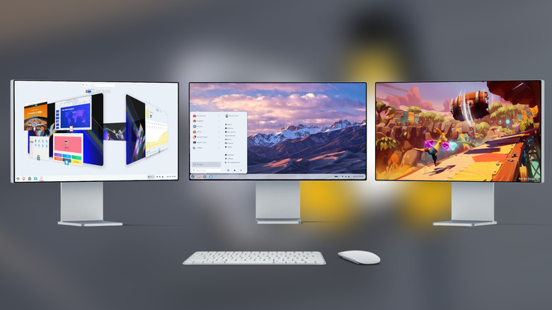 Zorin OS on 3 screens with keyboard and mouse, red background