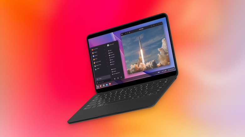 Zorin OS running on a laptop with a gradient background