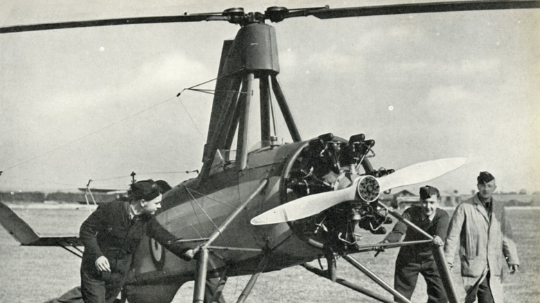 Avro 261 on ground being inspected by military personnel
