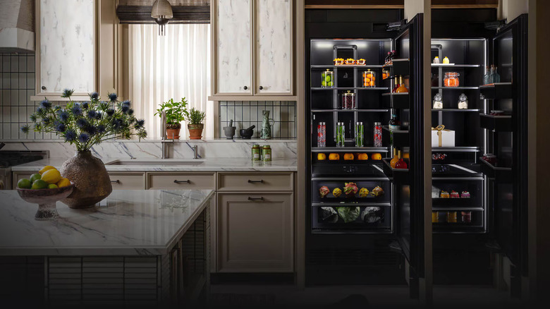 Two JennAir column refrigerators installed side-by-side in a modern, light kitchen