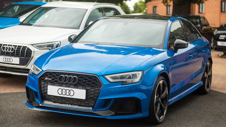 Two Audi A3s, one blue and one white
