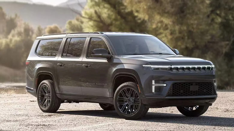 2026 Jeep Grand Wagoneer L on wooded arid background, front-right 3/4 view