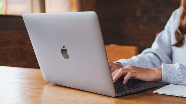 Woman using macbook